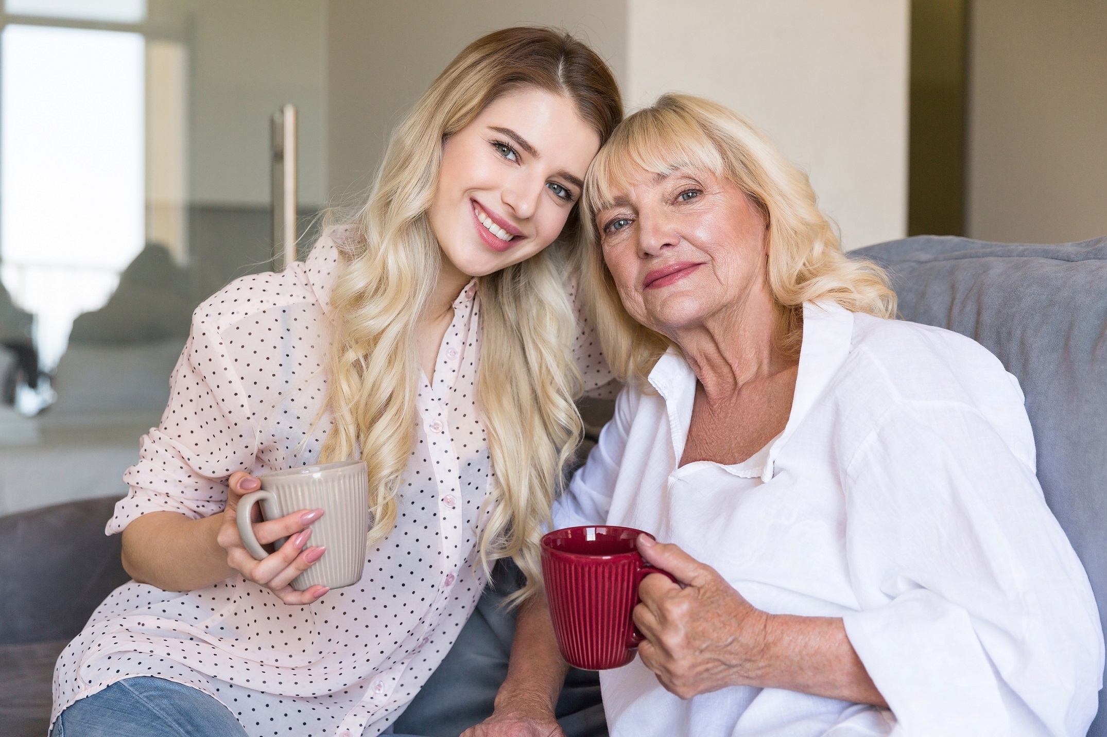 Smiling young granddaughter with parent at center